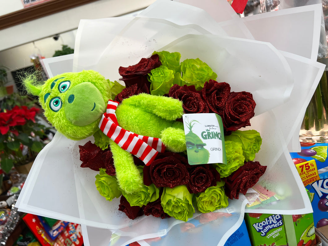 The Grinch plushie and roses