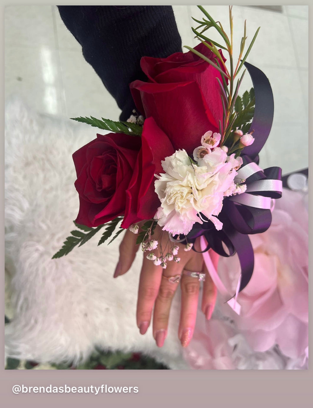 Red roses and carnation wrist corsage